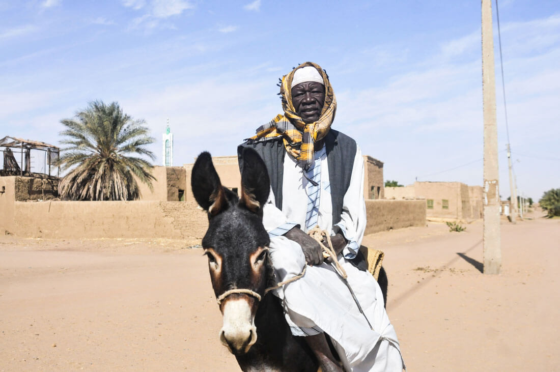 A Nubian man with his donkey